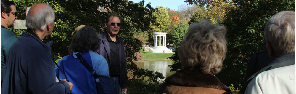 A scenic view of Mary Baker Eddy's grave and monument at Mount Auburn Cemetery