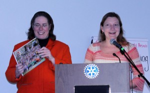 Ellen Schreiber(left) and Diane Miller, co-chairs of the Friends of Joey's Park, present a scrapbook for the Claflin Room's collection