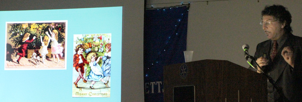 On Wednesday evening, December 18th, Kenneth Turino from Historic New England presented a well-illustrated lecture about the evolution of the celebration of Christmas in New England from 1620 to the present day. The slide in this photograph shows early Christmas cards from the 19th century.